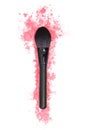 Black makeup brush and pink powder on a white isolated background.  Close-up.  View from above Royalty Free Stock Photo