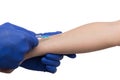 Black male hand in blue gloves holding a plastic syringe Royalty Free Stock Photo