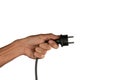 Black male hand holding an electric power plug isolated Royalty Free Stock Photo