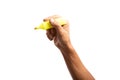 Black male hand holding a yellow marker pen, Highlighter isolated no background Royalty Free Stock Photo