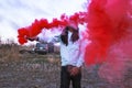 Black male playing with smoke bomb