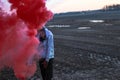 Black male playing with smoke bomb