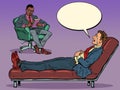 A black male psychotherapist is in a psychotherapy session with a patient, listening to a businessman, sitting in a