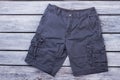 Black male shorts on wood. Royalty Free Stock Photo