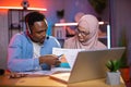 Black man and arabian woman using laptoptop for video call Royalty Free Stock Photo