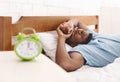 Black man in bed suffering from insomnia and sleep disorder Royalty Free Stock Photo