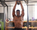 Black man, bodybuilder and kettlebell for fitness in gym, arm muscle training, portrait and weightlifting exercise