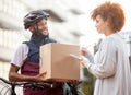 Black man, box and tablet in delivery service, package or parcel for female customer order in city. Happy African Royalty Free Stock Photo