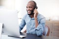 Black man, callcenter with phone call and computer, contact us with communication, headset and technology. Male