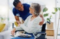 Black man, caregiver or old woman in wheelchair talking or speaking in homecare rehabilitation together. Medical