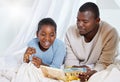 Black man, child and bed with book for story time, fairy tale or fantasy for imagination, learning or bonding at home Royalty Free Stock Photo