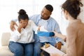 Black man comforting crying wife, couple attend family therapy Royalty Free Stock Photo