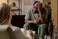 Black Man with Disability in Soldier Uniform Talking to Psychologist Royalty Free Stock Photo