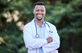 Black man, doctor portrait and arms crossed of healthcare and wellness professional outdoor. Success, motivation and Royalty Free Stock Photo