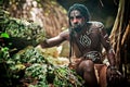 Black man with dreadlocks in the image of the Taino Indian in his habitat