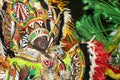 A black man dressed in a colorful costume at Junkanoo