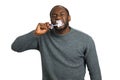 Black man enthusiastically brushing teeth.