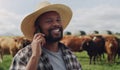 Black man, farmer and phone call with cows for discussion, agriculture or communication in countryside. Happy African or Royalty Free Stock Photo