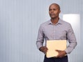 Black man, file or thinking of business, question or planning to solve, report or wonder in project. Businessman, paper Royalty Free Stock Photo