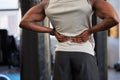 Black man, fitness or back pain in gym workout, exercise or training and body anatomy crisis, muscle burnout or spinal