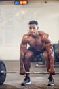 Black man, fitness and bodybuilder weightlifting for workout, exercise or training at the gym. African male person or Royalty Free Stock Photo