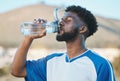 Black man, fitness or soccer player drinking water in training, exercise or workout in football field. Thirsty, sports Royalty Free Stock Photo