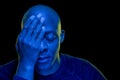 Black man with hand in eye and the other closed Royalty Free Stock Photo