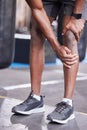 Black man, hands and knee pain in gym workout, training or workout in muscle burnout, anatomy tension or healthcare