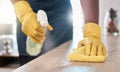 Black man hands, spray bottle or cleaning cloth for wooden table or desk in house living room, home or office building Royalty Free Stock Photo