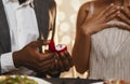 Black man holding box with wedding ring Royalty Free Stock Photo
