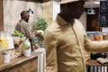 Black man holding a cabbage at counter Royalty Free Stock Photo