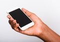 Black man holding mockup white modern digital mobile smart phone blank screen on hand Royalty Free Stock Photo