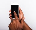 Black man holding smart phone blank screen on hand and point a finger to touch the screen Royalty Free Stock Photo