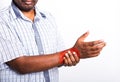 Black man holds his wrist hand injury, feeling pain Royalty Free Stock Photo