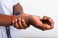 Black man holds his wrist hand injury, feeling pain Royalty Free Stock Photo