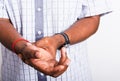 black man holds his wrist hand injury, feeling pain Royalty Free Stock Photo