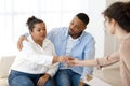 Black man husband comforting crying wife, couple attend family therapy Royalty Free Stock Photo