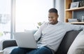 Black man with laptop, streaming online and relax in living room, subscription service with internet and happiness