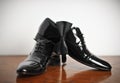 Black man leather shoe with shoelace on wooden floor