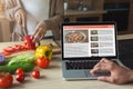 Black man looking at a recipe in laptop Royalty Free Stock Photo