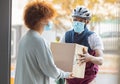 Black man, mask and delivery with box for woman at house for logistics, cargo and safety from covid 19. Young african Royalty Free Stock Photo