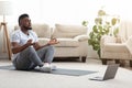 Black Man Meditating In Front Of Laptop, Practicing Yoga At Home