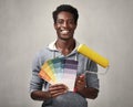 Black man with painting roller Royalty Free Stock Photo