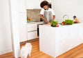 Black Man With Pe Cooking Talking On Phonet In Kitchen Royalty Free Stock Photo