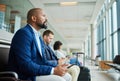 Black man, phone and airport in waiting room by window for travel, departure or business trip journey. African American Royalty Free Stock Photo