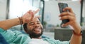 Black man, phone and peace sign on video call with smile for social, networking or communication at the office. African Royalty Free Stock Photo