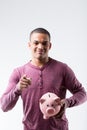 Man, piggy bank, promotes saving, white background Royalty Free Stock Photo