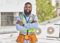 Black man, portrait and construction worker, arms crossed and maintenance, engineer smile and architecture outdoor. Male
