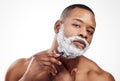 Black man, portrait and shaving cream with razor for beard grooming or hair removal, beauty or white background. Male Royalty Free Stock Photo