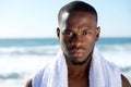 Black man posing with white towel at the beach Royalty Free Stock Photo